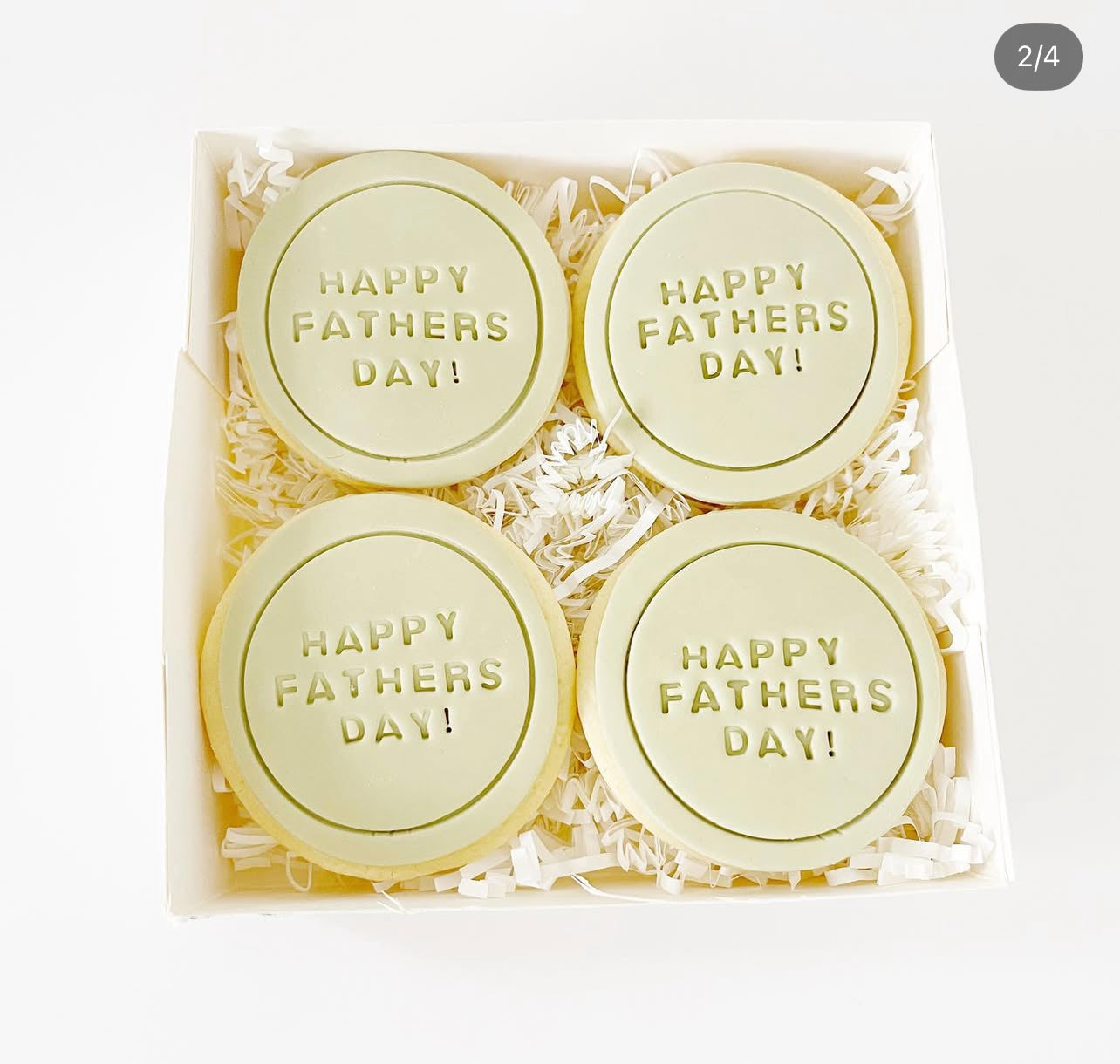 Four round yellow soap bars with 'Happy Father's Day!' text in a box on a white background